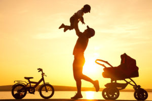 happy father with child on sunset
