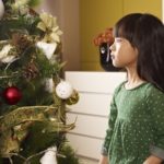 On this Day of Your Birth....little asian girl sits next to christmas tree