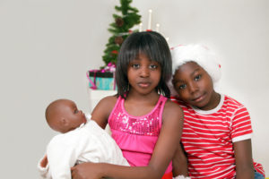 Sad kids on Christmas with hopeful expression