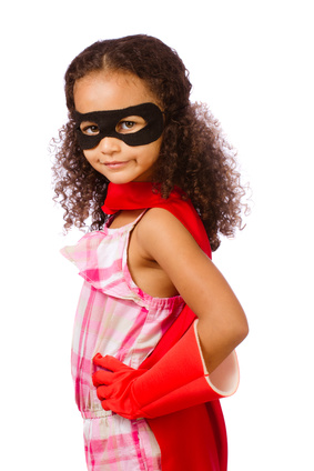 Portrait of pretty mixed race girl playing super hero