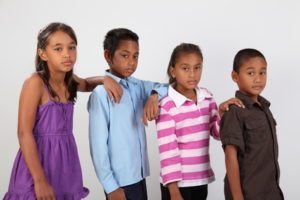 Four young school friends looking serious