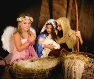 On this Day of Your Birth....Little 7 year old angel visiting a nativity scene reenacted with a doll